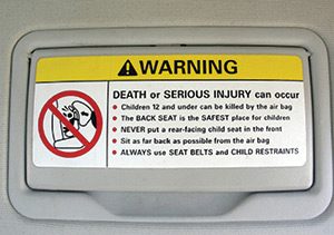 Vehicle visor airbag warning sticker. Air bag defect and litigation