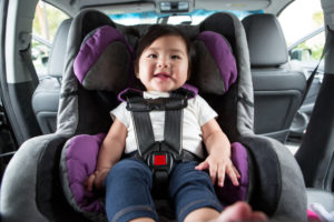 Baby sitting in car seat, ready to go for a ride!