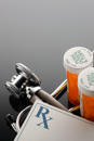 A prescription RX pad with two closed orange pill bottles. What to do to protect yourself from prescription errors.