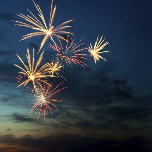 Brightly colorful fireworks in the night sky. How to stay safe this Fourth of July.