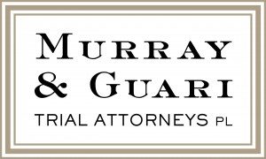 Murray Guari's Logo. Acera de Murray Guari. Hablamos Espanol.