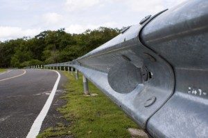 Guardrail along a roadside. Guardrail manufacturer fails todisclose product dangers.