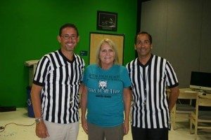 A photo of attorney Scott Murray and Jason Guari along with SADD Coordinator, Maureen Witowski at Royal Palm Beach High School preparing a student PSA to promote the Battle of the Belts! competition. 