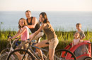 Family of three biking. Learn Some Cycling Tips to Keep You Safe on Florida's Roadways and reduce bicycle fatalities.
