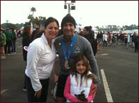 Photo of Jason Guari and him family after finising his first half marathon, the Walt Disney World Half Marathon, as a member of The Leukemia and Lymphoma Society's Team In Training. 
