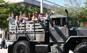  A photo of Scott and Jamie Murray joined colleagues, friends and family in a military truck riding in the Veteran's Day Parade.. 