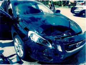 Black Car with Front End passenger side damage from auto acciden.