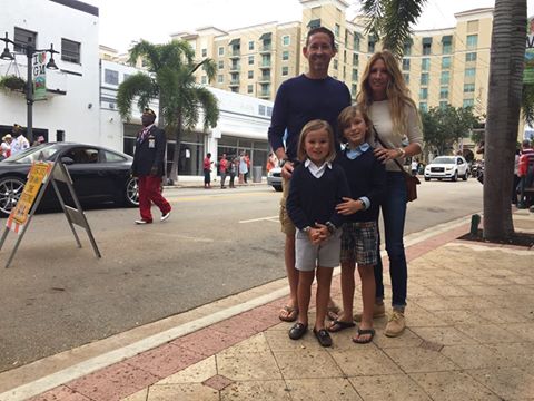 Attorney Scott Murray and Family along Clematis Street watching the Veterans Day Parade