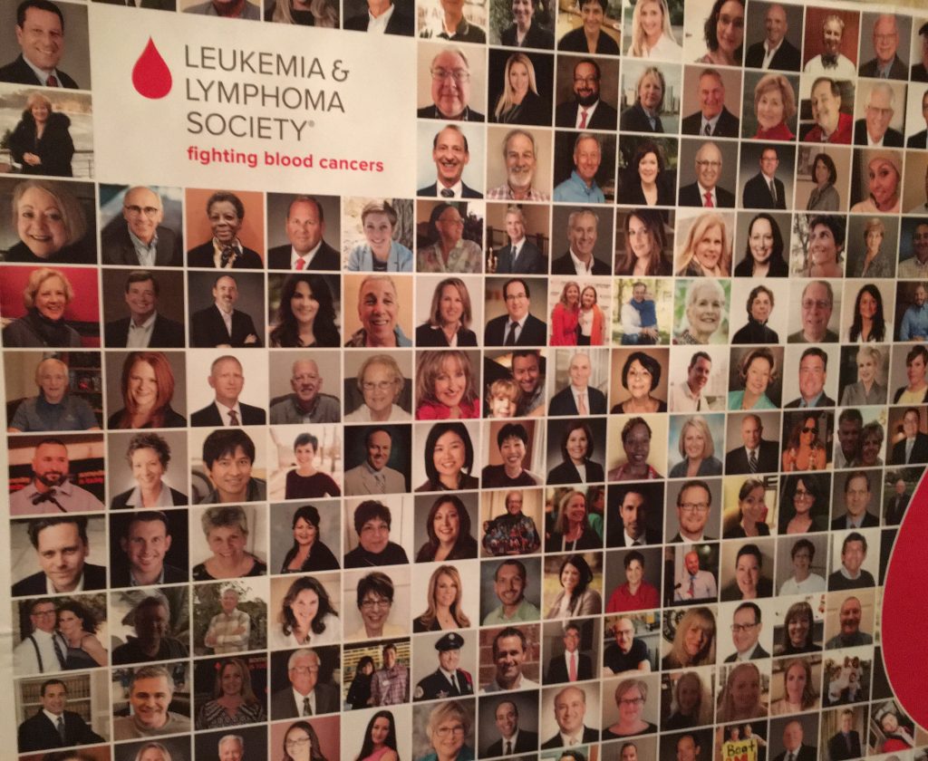 A Leukemia & Lymphoma poster with headshots of volunteers.