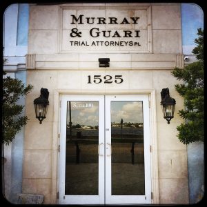The Front Door of Murray & Guari with sign over doorway