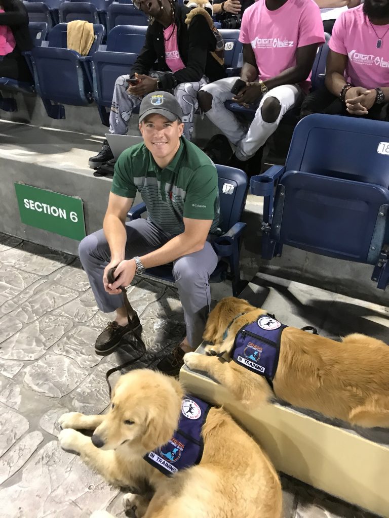 Attorney Keith Hedricks with Genesis Assistance Dog's Oliver and Atticus.