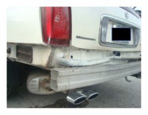 White car that has rear-end damage from auto accident