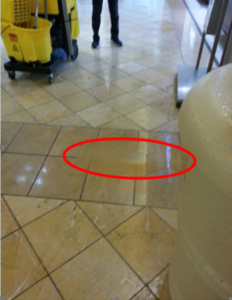 Picture of floor with a red circle indicating accident - slip and fall