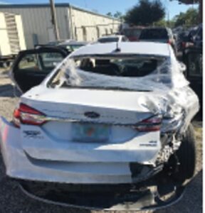 White car with side vehicle damage