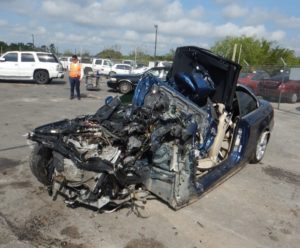 Blue Sedan involved in crash with front end damage