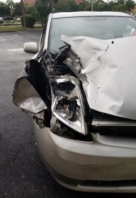 White car after auto accident front passenger damage