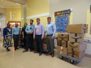 Members of Palm Beach County Bar Association deliver snacks and school supplies to local school