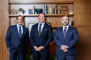 Standing Photo of the partners Jason Guari, Scott Murray and Scott Perry