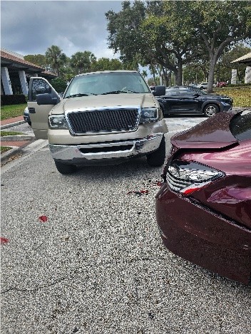 Crushed vehicles involved in a parking lot accident