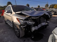 Grey car with severe front end damage due to auto accident
