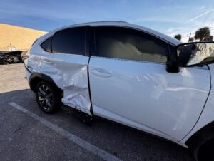 white suv with rear passenger side damaged due to a motor vehicle accident