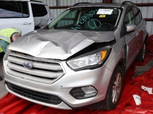 Vehicle that caused a rear-end collision showing damanged to hood