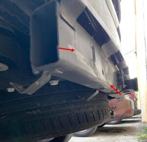 Close up of rear-end damage to a black SUV