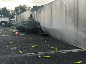 car imbeded into a tractor trailer after accident