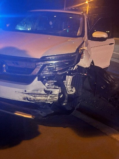White SUV with Front End Damaged due to Auto Accident